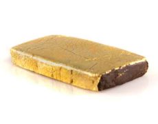 A bar of legal hash covered with a film of gold